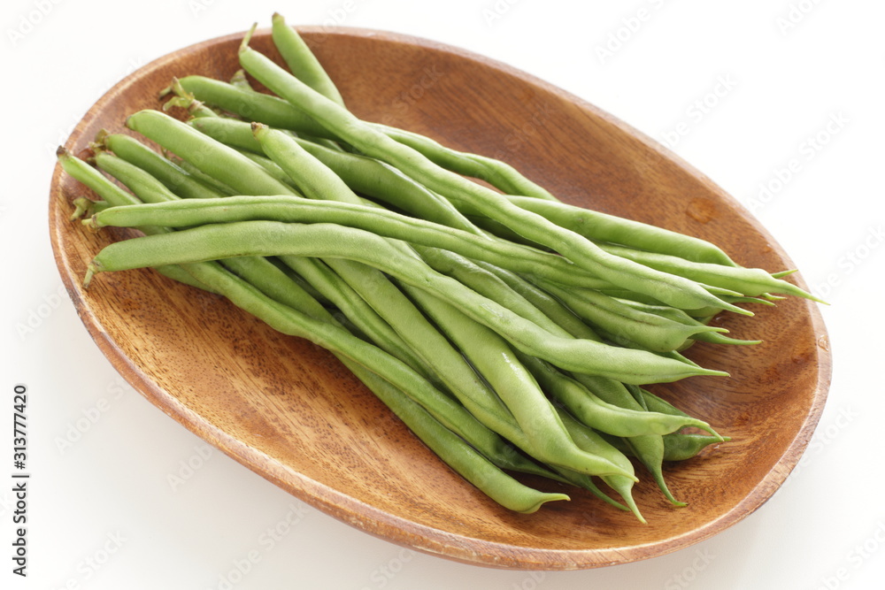 Freshness green bean on wooden plate for healthy food ingredient Freshness green bean on wooden plate for healthy food ingredient