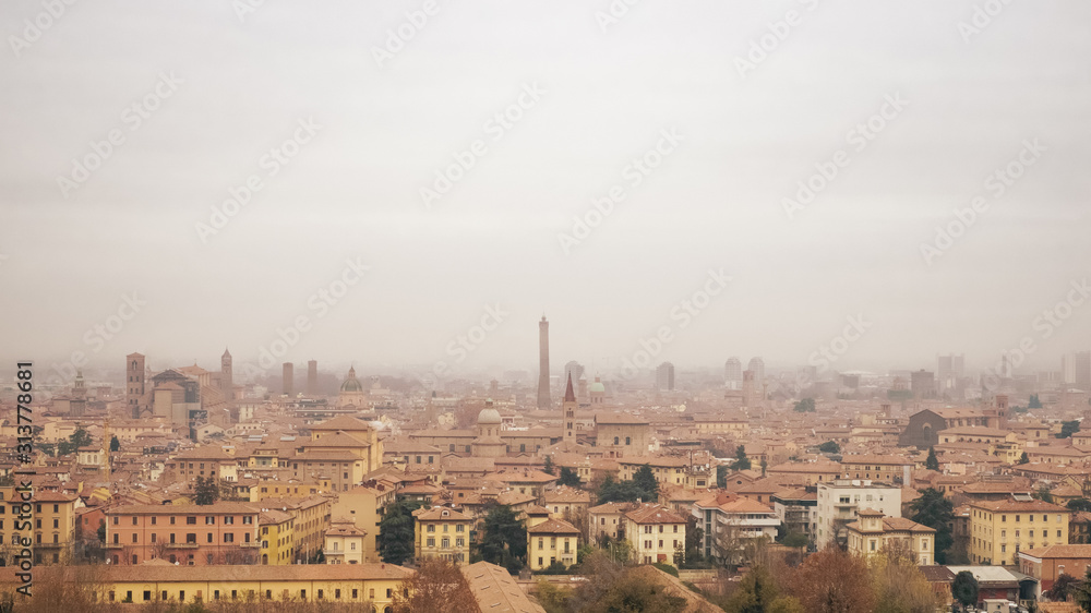The medieval city of Bolona in foggy weather –panoranic view – Bologna, Emilia Romagna, Italy.