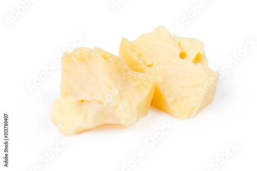 Two broken pieces of the hard cheese on white background