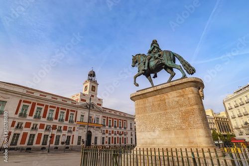 Madrid Spain, city skyline at Puerta del Sol and Clock Tower of Sun Gate with Equestrian Statue of Carlos III