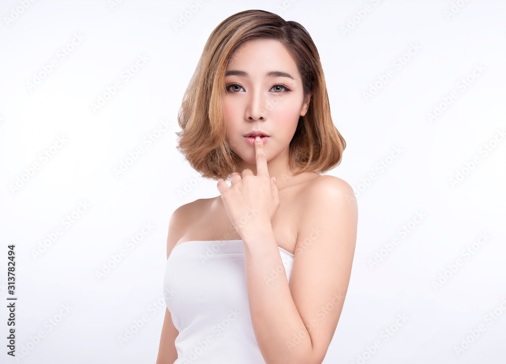 Beauty Young asian woman with perfect facial skin. Gestures for advertisement treatment spa and cosmetology. Beauty Young asian woman with perfect facial skin. Gestures for advertisement treatment spa and cosmetology.