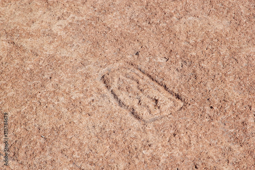 Petroglyph at the Campo Las Tobas a site with rock art in which the engravings were made on the ground, Argentina photo