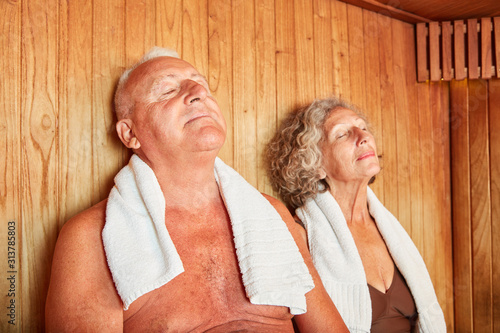Senior couple enjoys spa sauna photo
