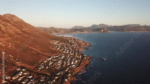 4K sunny summer early morning aerial drone video of Atlantic Ocean boulders coast near Murdock Valley on the outskirts of Simon's Town en route to Cape Of Good Hope, Western Cape, South Africa photo