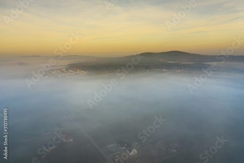 Aerial view of morning fog and sunrise in autumn © Lukasz Janyst