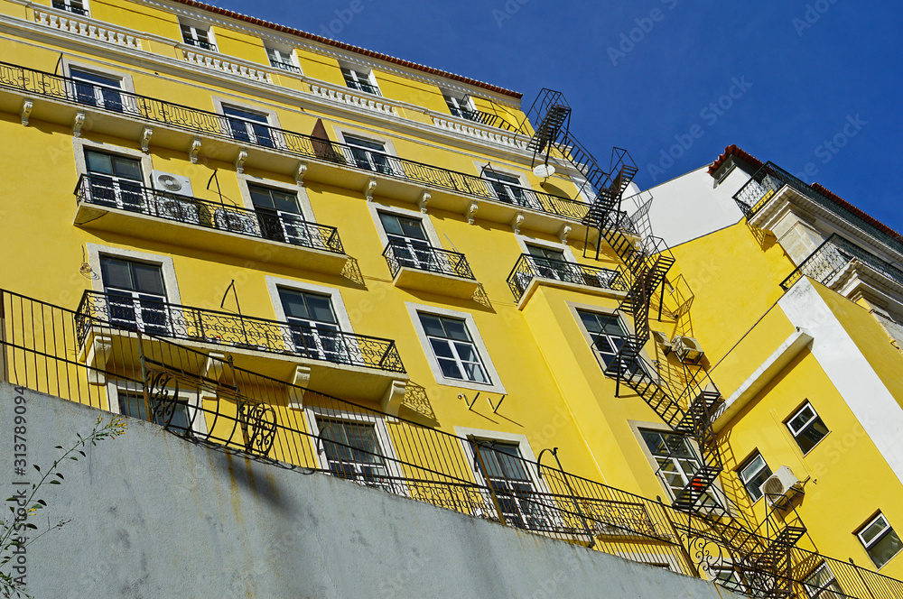House with yellow facade