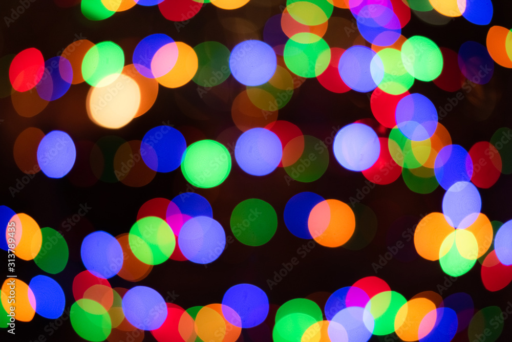 Defocused abstract multicolored bokeh lights background. Holidays concept