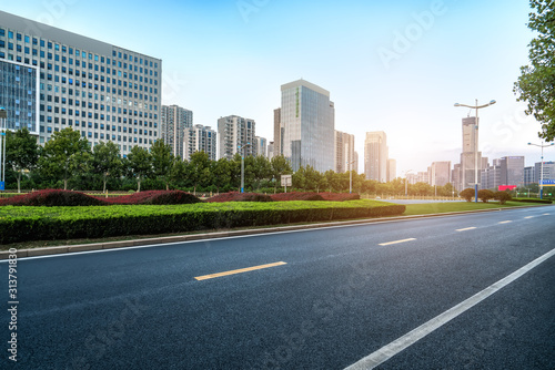 Road pavement and modern building in Jinan financial district