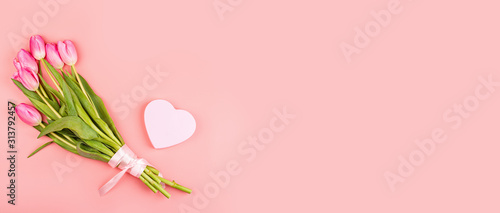 View from above tulips and gift box with copy space. Background for womens day, 8 March. Flat lay style, top view, mockup, template, overhead. Greeting for Womens or Mothers Day. #313792457