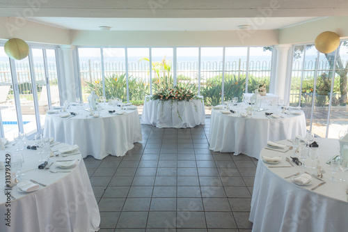 A small hall decorated for a wedding reception