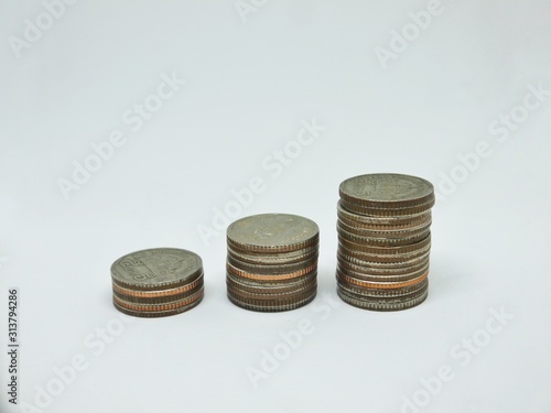 Pile of Thailand coins money on isolated white background. Money, Financial, Business growth concept.