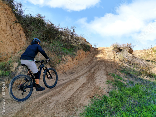 MTB biker on a sandy road