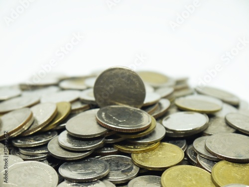 Several Thai coins isolated on white background, heap of coins silver gold, copper thai coin, baht currency.