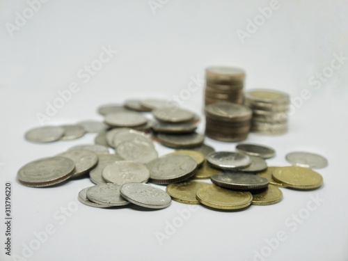 Pile of Thailand coins money on isolated white background. Money, Financial, Business growth concept.