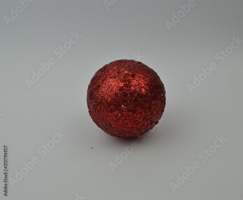  red christmas ball lies on a white background