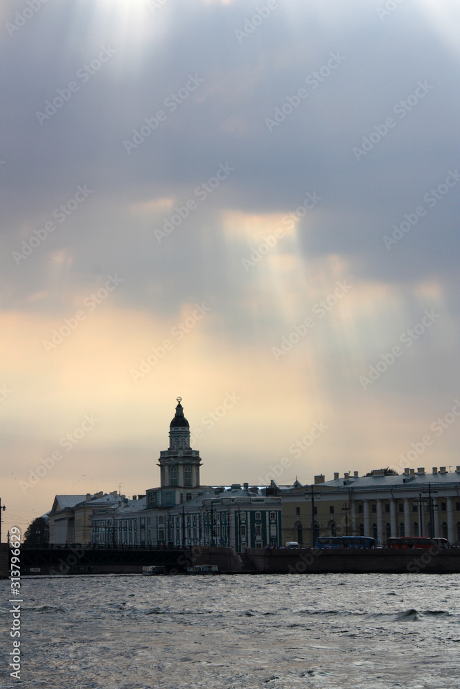 Dramatic sky over the silhouette of the Kunstkamera, also known as Kunstkammer, in St. Petersburg, Russia