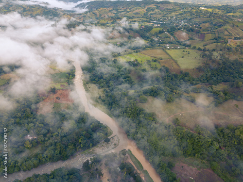 aerial drone view valley landscape with junction of river jimenoa and yaque in jarabacoa dominican republic 