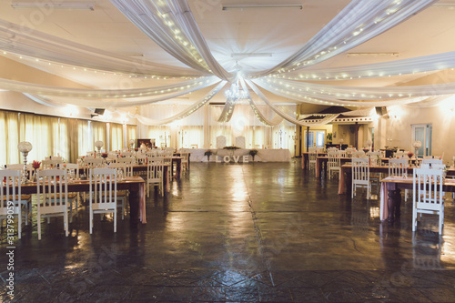 A hall decorated for a wedding reception