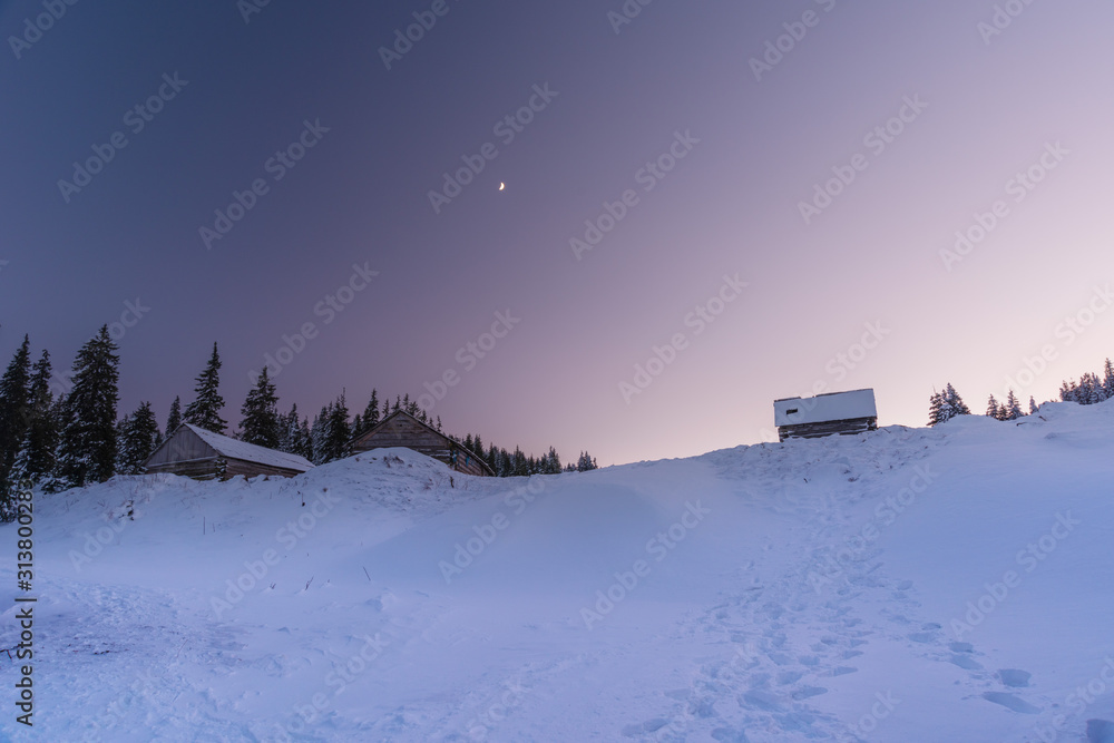 A charming evening with beautiful sky and mountain houses in the Ukrainian Carpathians