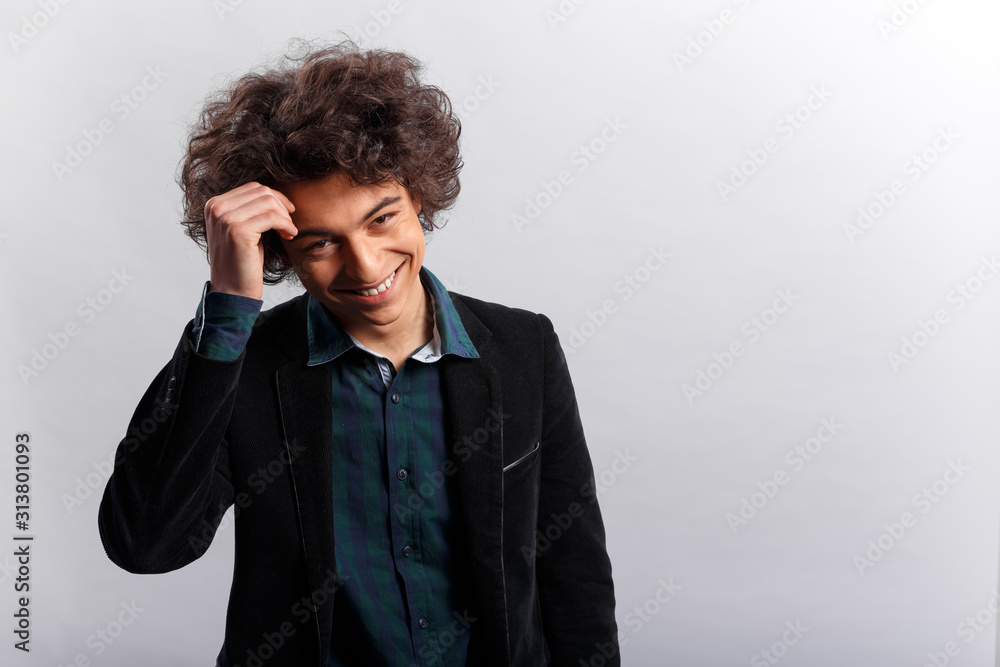 Horizontal view of a smiling young boy in jacket with hide face because of love. Space for text. Horizontal view of a smiling young boy in jacket with hide face because of love. Space for text.