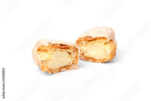 Coconut eclairs or custard cookies isolated on white background.