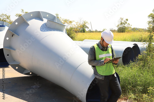 Mechanic engineer holding a ipad in the champagne bucket factory