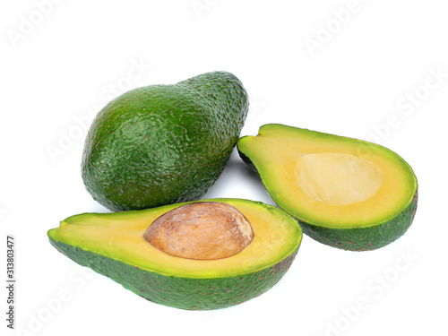 Avocado and avocado halfs isolated on a white background.