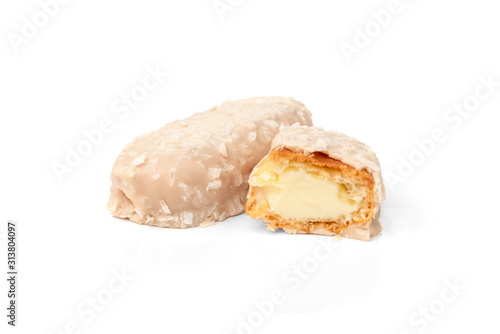 Coconut eclairs or custard cookies isolated on white background.