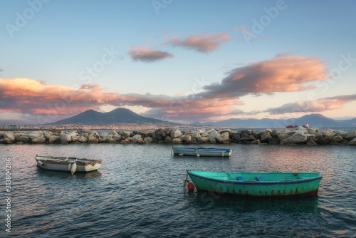 Mount Vesuvius and Naples bay with the fishermen boats at the sunset (Napoli bay), Italy