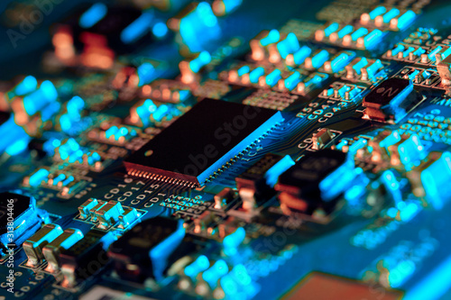 Electronic circuit board with electronic components such as chips close up. The concept of the electronic computer hardware technology.	