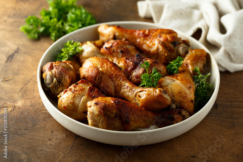 Roasted chicken drumsticks with fresh parsley