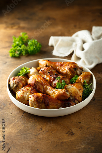 Roasted chicken drumsticks with fresh parsley