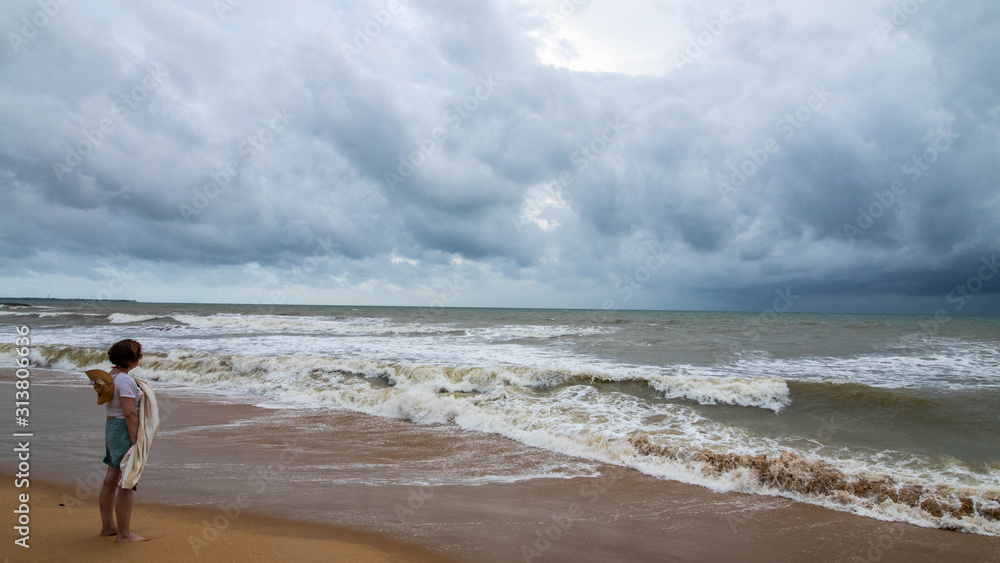 Woman facing storm (Negombo, Sri Lanka)