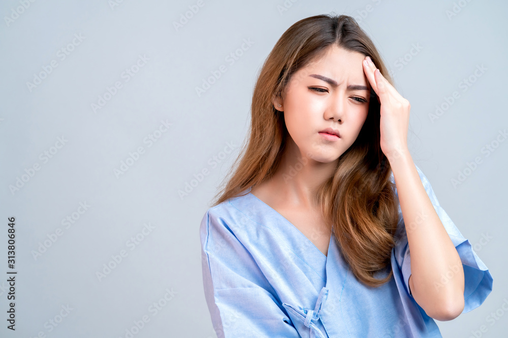 sick asian female hand touch body head with bad feeling headache and stress in hospital uniform health and illness ideas concept sick asian female hand touch body head with bad feeling headache and stress in hospital uniform health and illness ideas concept