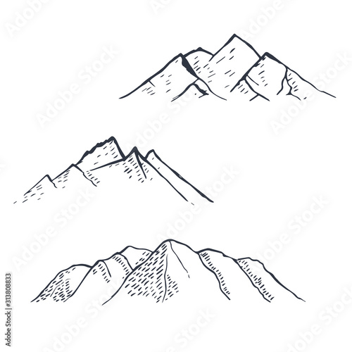 Mountains set. Hand drawn rocky peaks. Vector
