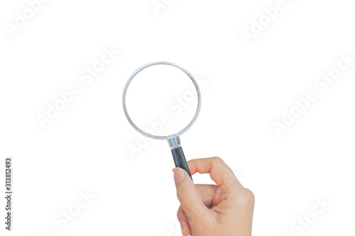 Female hand holding black magnifying glass isolated on white background.