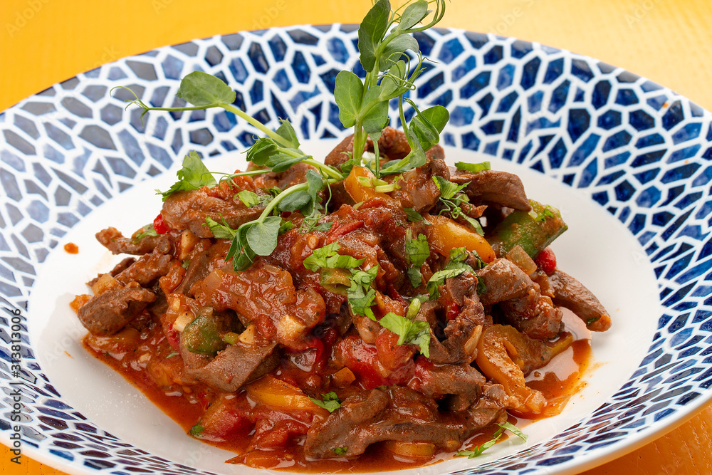 Asian lamb heart in tomato sauce, coriander and spices
