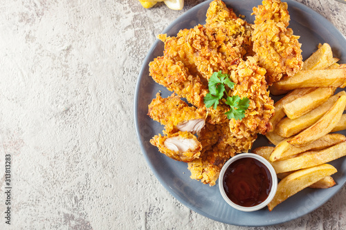 Chicken strips in cornflakes breadcrumb photo