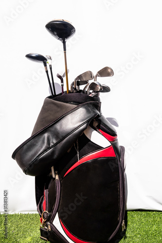 Golf bag placed on a green artificial grass means being prepared for the game of golf