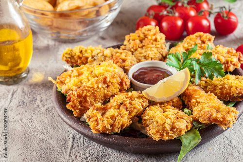 Obraz na płótnie Chicken strips in cornflakes breadcrumb