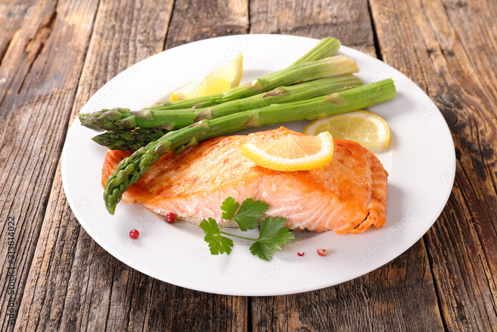 salmon fillet and asparagus on plate salmon fillet and asparagus on plate