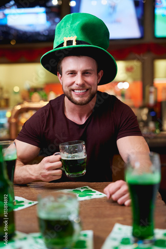 Man with leprechaun's hat and beer celebrating Saint Patrick's Day