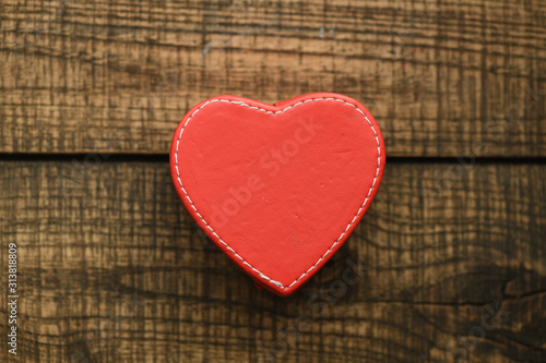 Valentine`s day concept background. Heart on a wooden table.