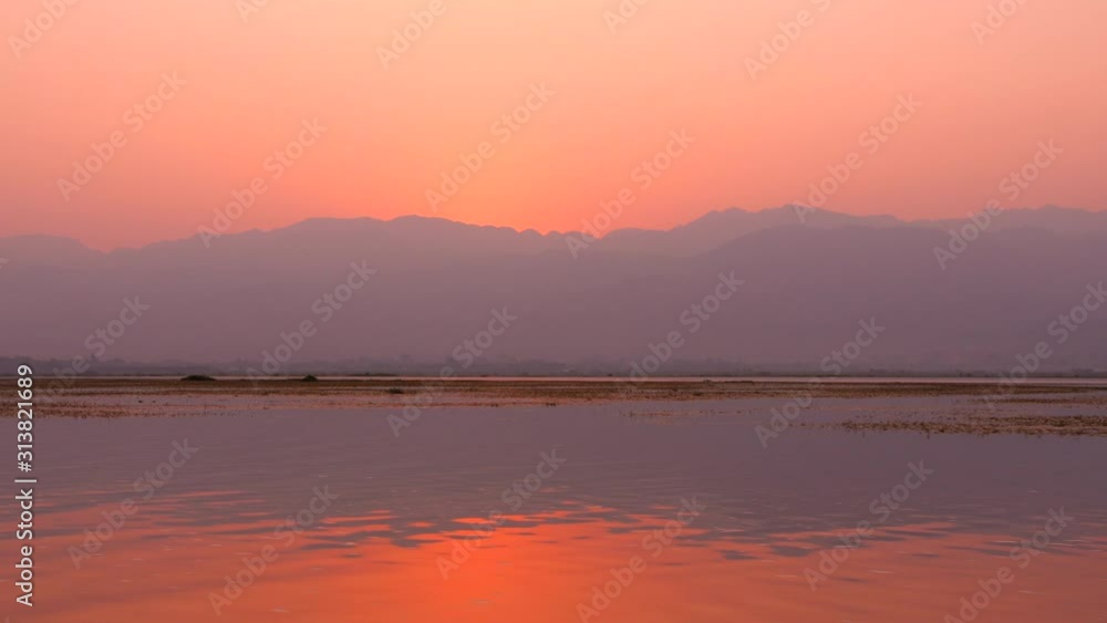 Beautiful Calm Sunrise On Inle Lake. 4K Slow Motion Footage. Myanmar. Beautiful Calm Sunrise On Inle Lake. 4K Slow Motion Footage. Myanmar.