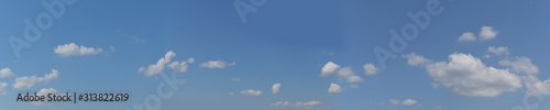 blue sky background with white tiny clouds. panorama picture