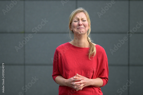 Картината върху платно Upset woman screwing up her face in anguish