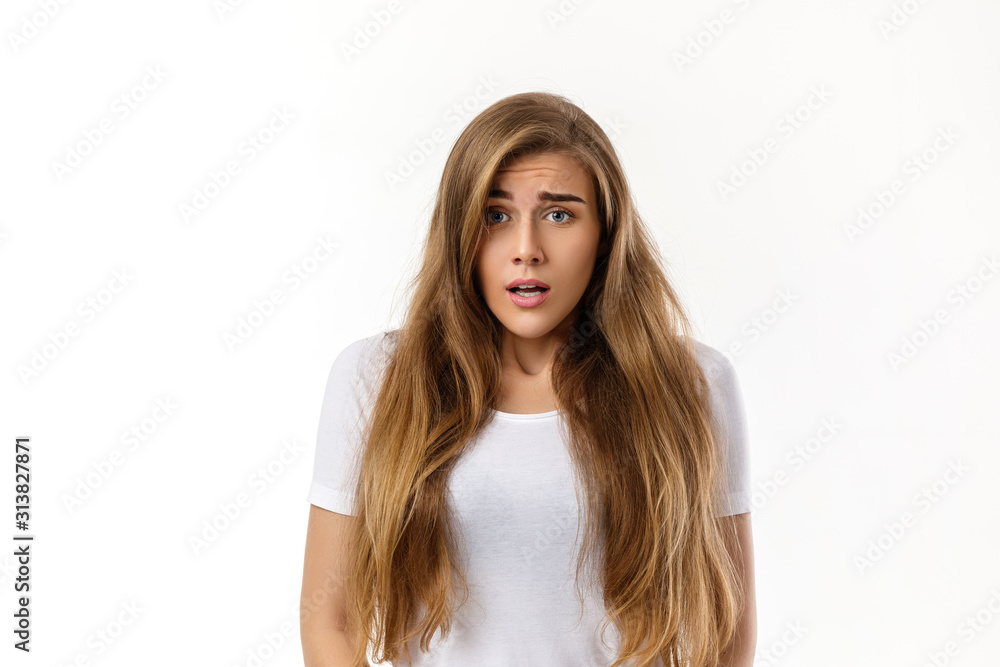 Portrait of young surprised beautiful woman with shocked facial expression on white background Portrait of young surprised beautiful woman with shocked facial expression on white background