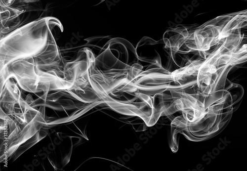 movement of fire design on black background. white smoke on dark