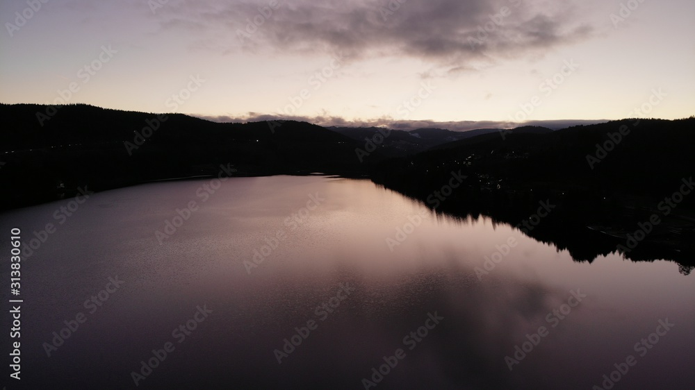 lake in winter surrounded forest