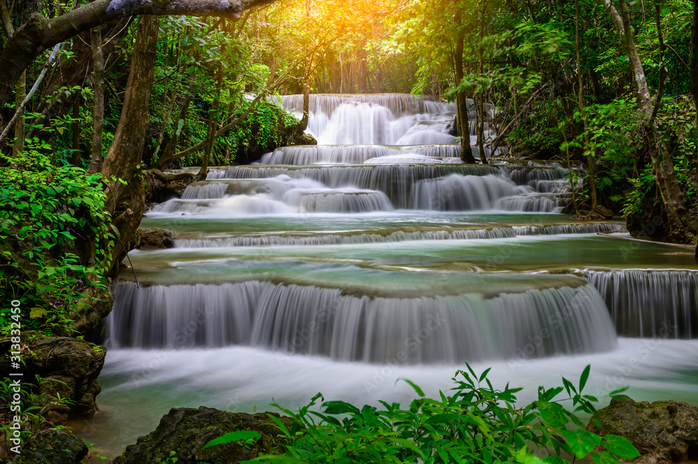 A beautiful waterfall deep in the tropical forest steep mountain adventure in the rainforest.